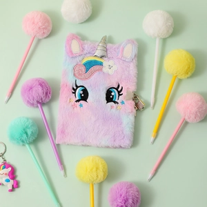 Detail of plush tie-dye unicorn diary with silver horn and rainbow mane features a padlock