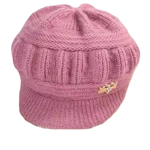 Pink winter knit beanie for elderly women featuring a stylish brim and heart buckle