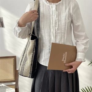 Chic striped plush tote bag paired with vintage lace shirt and pleated skirt