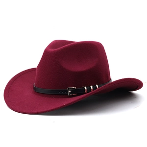 Macro detail of burgundy wool fedora hat featuring black leather belt and silver metal buckle