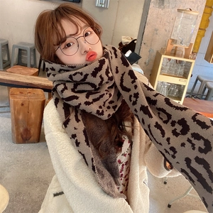 Women's leopard print knitted scarf in brown and black for stylish winter warmth