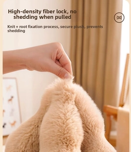 Detailed macro showing the high-density lint-free plush fabric of the pet blanket