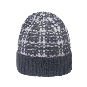 Detailed close-up of heavy knit checkerboard pattern and ribbed cuff on winter beanie