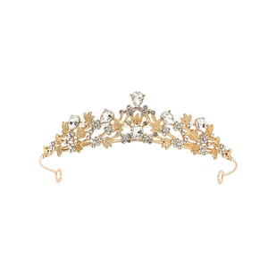 Close-up of golden baroque crown featuring intricate leaf patterns and clear crystals