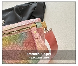 Close-up of rainbow gradient leather texture with premium gold metal zipper detail