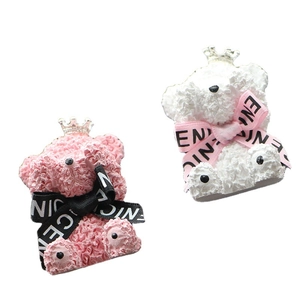 Pink and white teddy bear car perfume clips with rose texture on white background