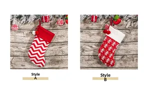 Detail of Style A chevron and Style B tree pattern knitted Christmas stockings with pom-poms