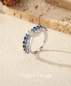 Detailed macro view of S925 sterling silver mermaid tail ring with blue zircon stones