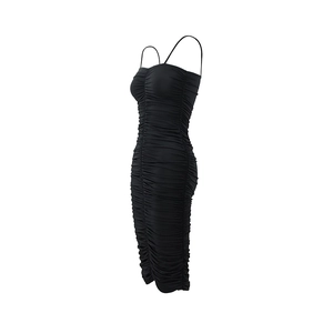 Detail view of the side profile on a black ruched slim fit spaghetti strap dress