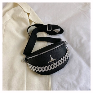 Detail of black pebbled leather waist bag with silver chain and star emblem detail
