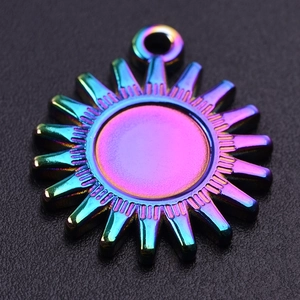 Detail of a sun-shaped 304 stainless steel pendant with a vibrant rainbow gradient finish