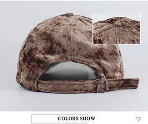 Detail of dark brown suede baseball cap featuring premium metal adjustable buckle closure