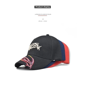Close-up of premium cotton baseball caps featuring 3D fish bone embroidery in four colors