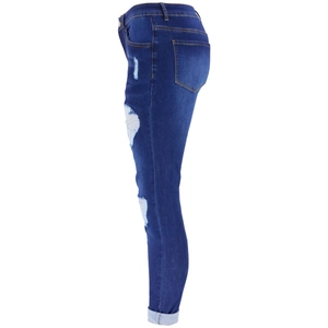 Detail view of high waist skinny jeans with side ripped holes and smooth stitching