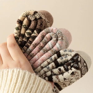 Three pairs of thick wool socks with colorful geometric patterns for winter warmth