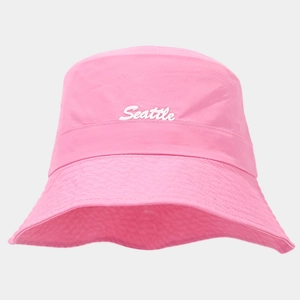 Detail of pink Seattle bucket hat featuring white cursive embroidery and reinforced stitching