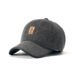 Winter gray herringbone tweed baseball cap with ear flaps and leather brand patch