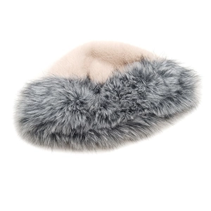 Close-up of winter faux fox fur hat showing thick texture and mixed grey pink tones