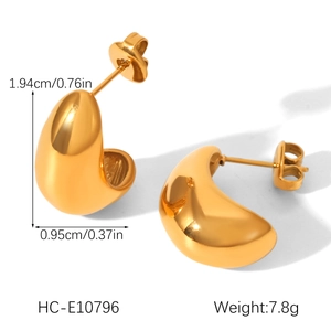 Detailed view of gold C-shape drop earrings with 1.94cm height and size dimensions