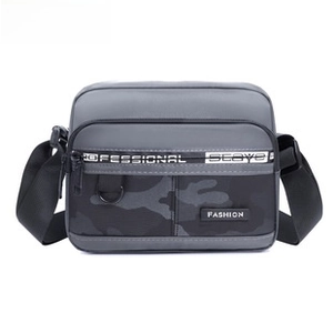 Detail of waterproof grey camo chest bag with adjustable strap and zip pocket