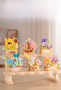Six different building block flower baskets featuring roses and sunflowers on a wooden shelf