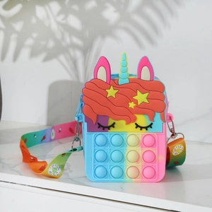 Close-up of rainbow unicorn silicone pop-it bag with adjustable printed strap for kids