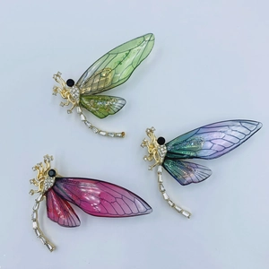 Elegant insect brooches with dragonfly design in green pink and purple tones