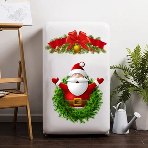 Christmas Santa Claus and red ribbon wall decal on a vintage white refrigerator