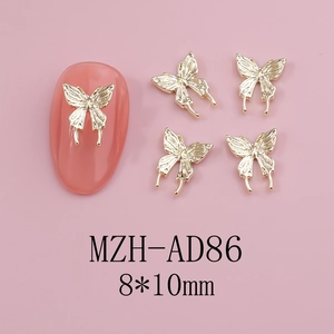 Macro shot of 8x10mm gold hollow butterfly nail charms on pink manicure display
