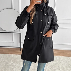 Detailed view of women's black hooded windbreaker with drawstring waist and large pockets