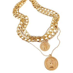 Layered gold chain necklace with embossed coin pendants and vintage portrait medallion