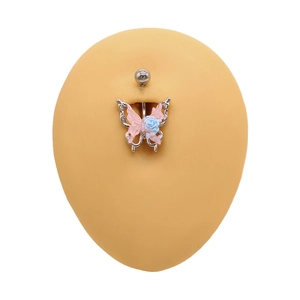 Detail view of butterfly belly ring with pink wings and blue flower on skin model