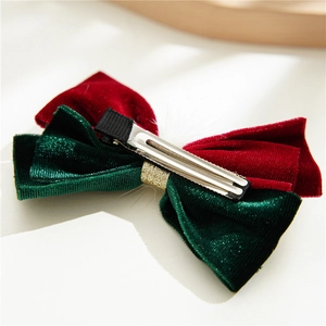Christmas velvet bow hair clip in red and green with sparkling gold glitter accents