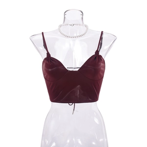 Detail of dark red PU leather camisole showing glossy texture and irregular hemline