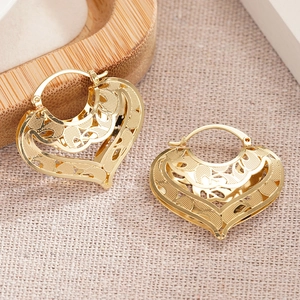 Elegant gold heart hollow hoop earrings with intricate vintage filigree patterns for women