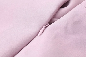 Detailed macro view of high-quality invisible zipper on a lavender woven mini dress