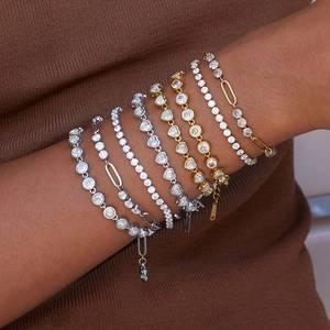 Luxurious gold and silver stainless steel zircon layered bracelets set on female wrist