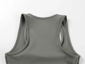 Detail of the high-elastic square neck and refined stitching on this grey sports tank top
