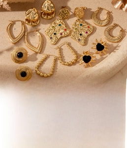Collection of gold titanium steel earrings with heart and geometric zircon details