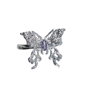 Silver butterfly open ring with a central purple gemstone and textured metal finish