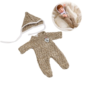 Detail of 30cm doll knit romper and pointed hat set with shield emblem on white background