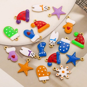 Colorful Christmas enamel charms including Santa hats and stars for DIY jewelry making