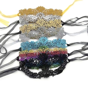 Detailed view of intricate lace textures and silk ties on multi-colored masquerade masks