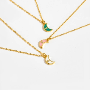 Detailed macro view of S925 silver crescent moon necklaces with colorful enamel inlay