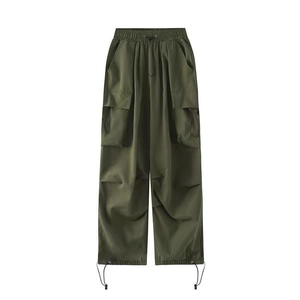 Military green cargo pants with drawstring waist and wide-leg silhouette in flat lay view