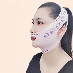 Pink V-line lifting face mask for chin tightening and contouring on female model