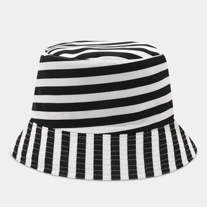 Detail of double-sided graffiti bucket hat showing high-quality striped canvas fabric texture