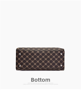 Detail view of the handbag bottom featuring floral print and silver protective metal feet