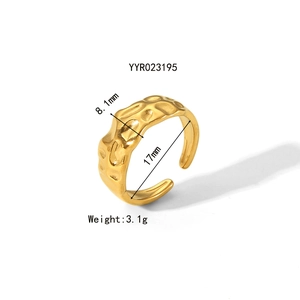 Detail of 8.1mm golden hammered steel ring showing irregular texture and dimensions