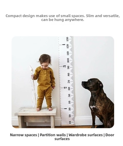 Detail of wooden height growth chart showing cm and feet scales in a cozy home setting